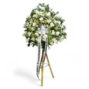 Sympathy Flowers in copa vase and bamboo tripod