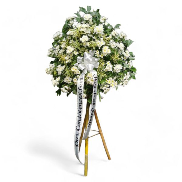 Sympathy Flowers in copa vase and bamboo tripod