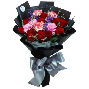 Bouquet of mixed dozen red roses and carnations wrapped in black with gray ribbon.