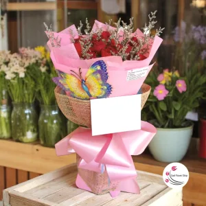 Bouquet of roses in burlap ang pink wrap