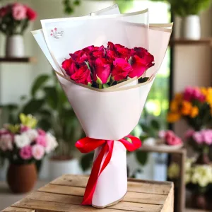 Bouquet of roses wrapped in nude paper color wrapper